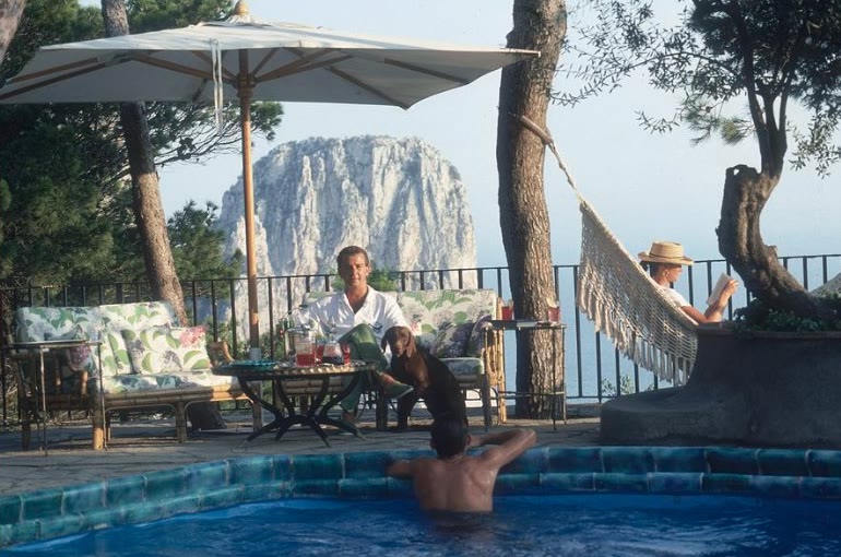A Slim Aarons-style poolside terrace on Capri